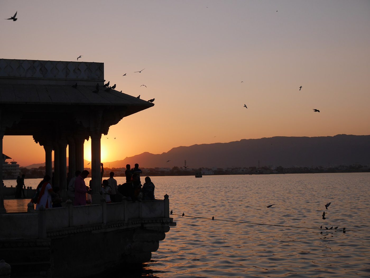 Marble pavilion on Ana Sagar lake at sunset