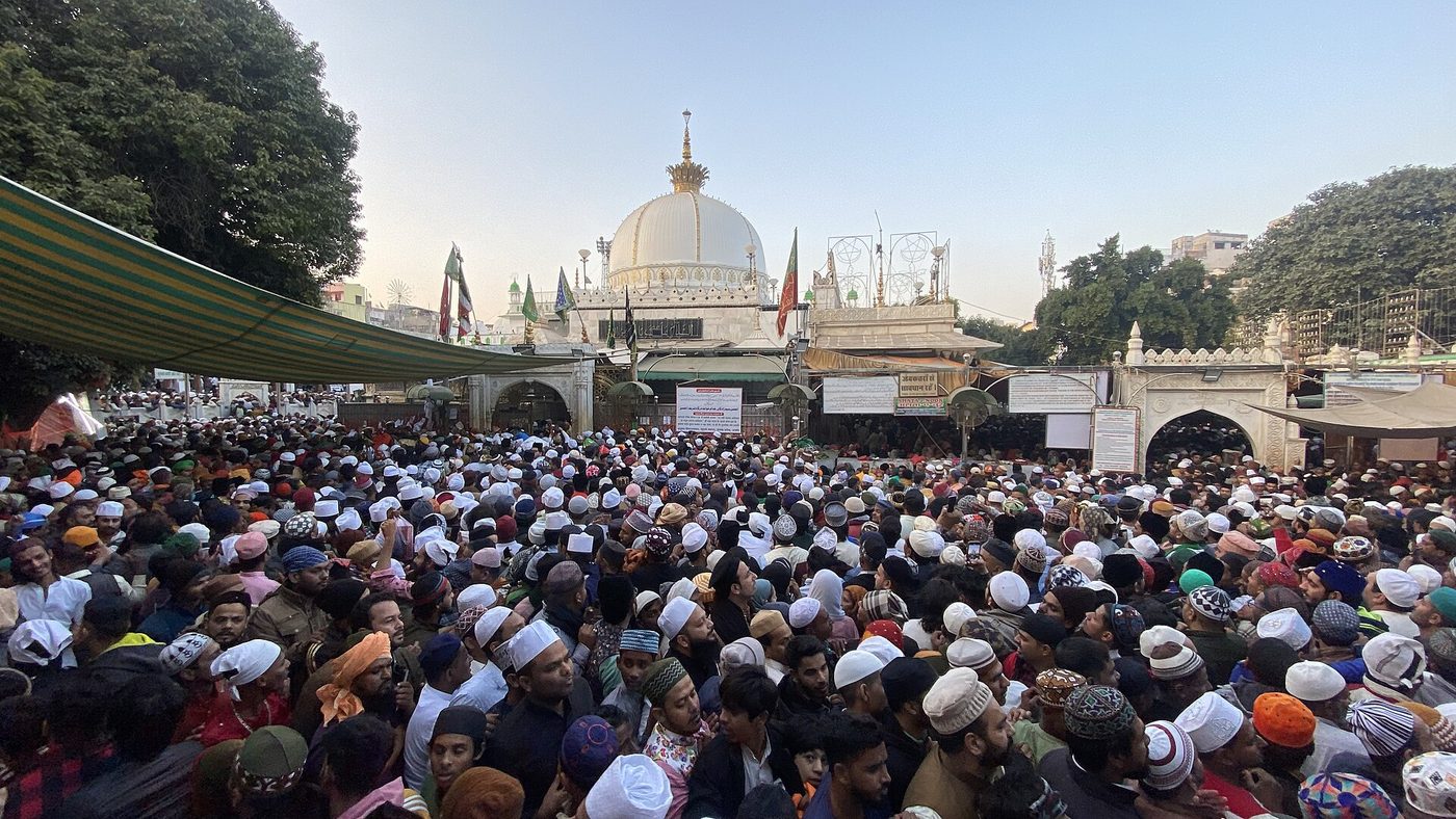Pilgrims gathered before the dome